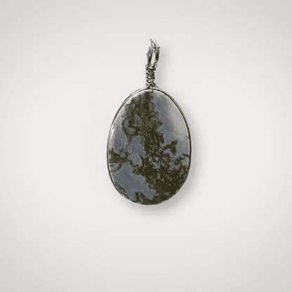Close-up of Indonesian Blue Opal pendant with silver wire wrap
