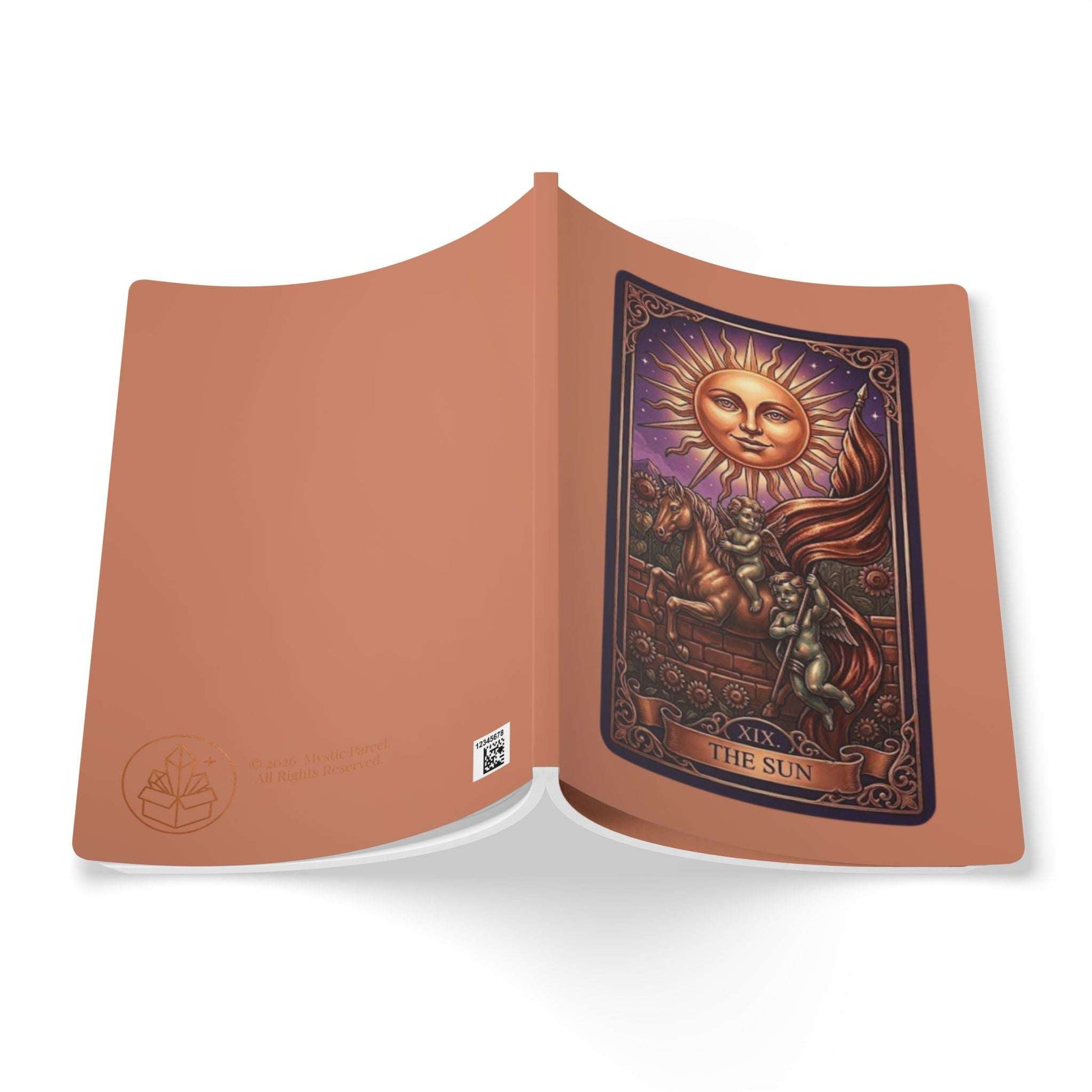 Open book with a tarot card design featuring a sun and angel on a white background