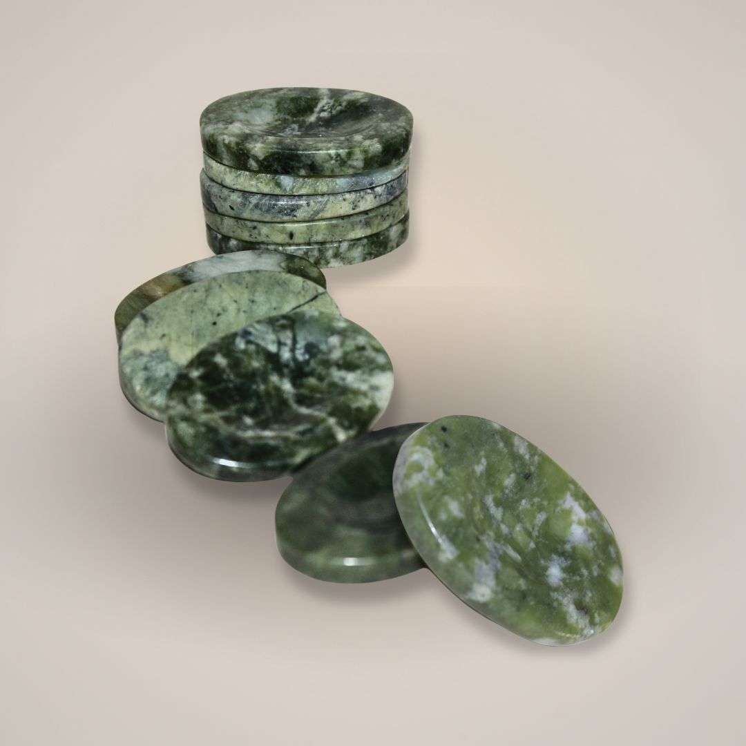 Polished nephrite gemstone palm stone held in hand for daily support and calm