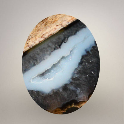 Close view of quartz geode interior within polyhedral agate