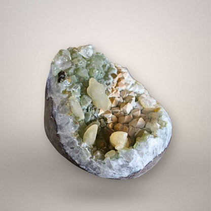 Depth view into quartz geode cavity highlighting druzy quartz boundary and multi-phase calcite growth
