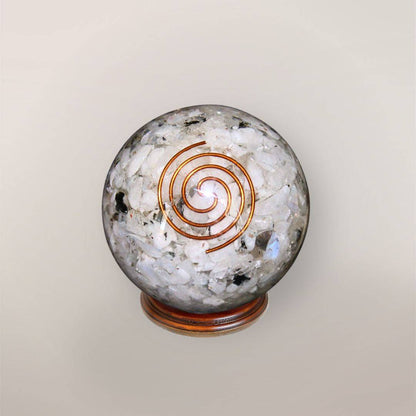 Rainbow Moonstone orgonite sphere with Indian Rainbow Moonstone chips, copper spiral, copper flakes, and wood display stand