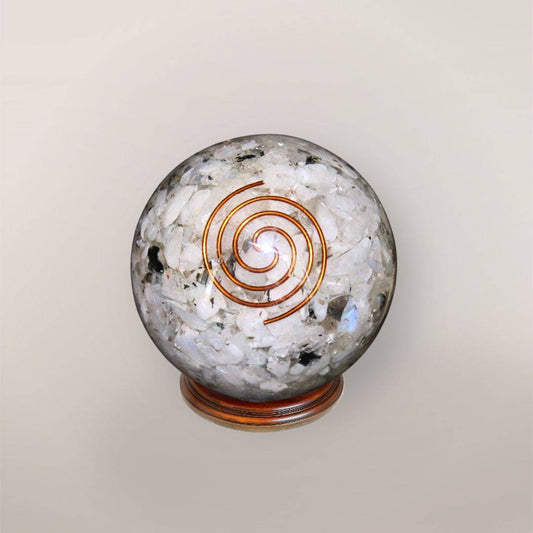 Rainbow Moonstone orgonite sphere with Indian Rainbow Moonstone chips, copper spiral, copper flakes, and wood display stand