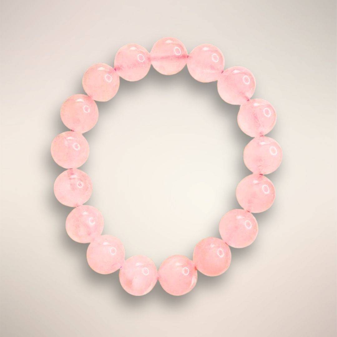 8mm Rose Quartz beads, emphasizing their smooth finish and gentle pink tone
