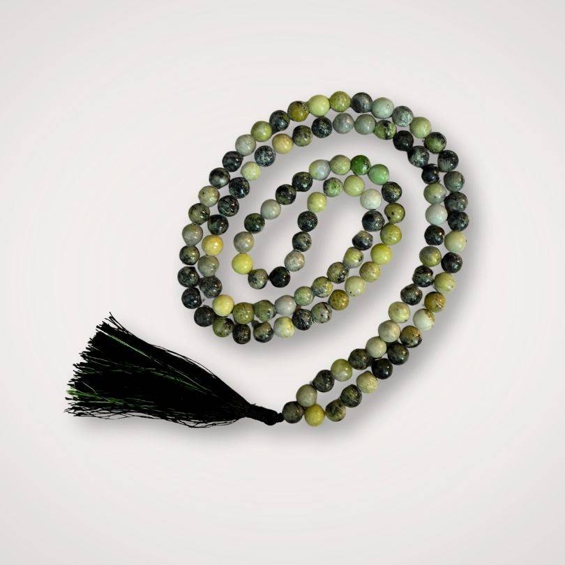 Serpentine Mala with 108 polished 8mm beads in green and black tones, featuring a black tassel for grounding and renewal meditation practices.
