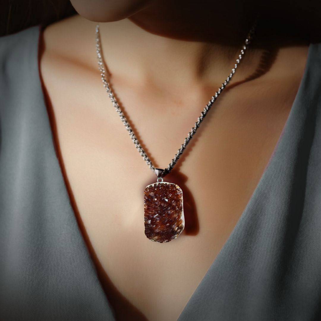 Smoky citrine cluster pendant worn as a necklace in lifestyle image, chain shown for styling only