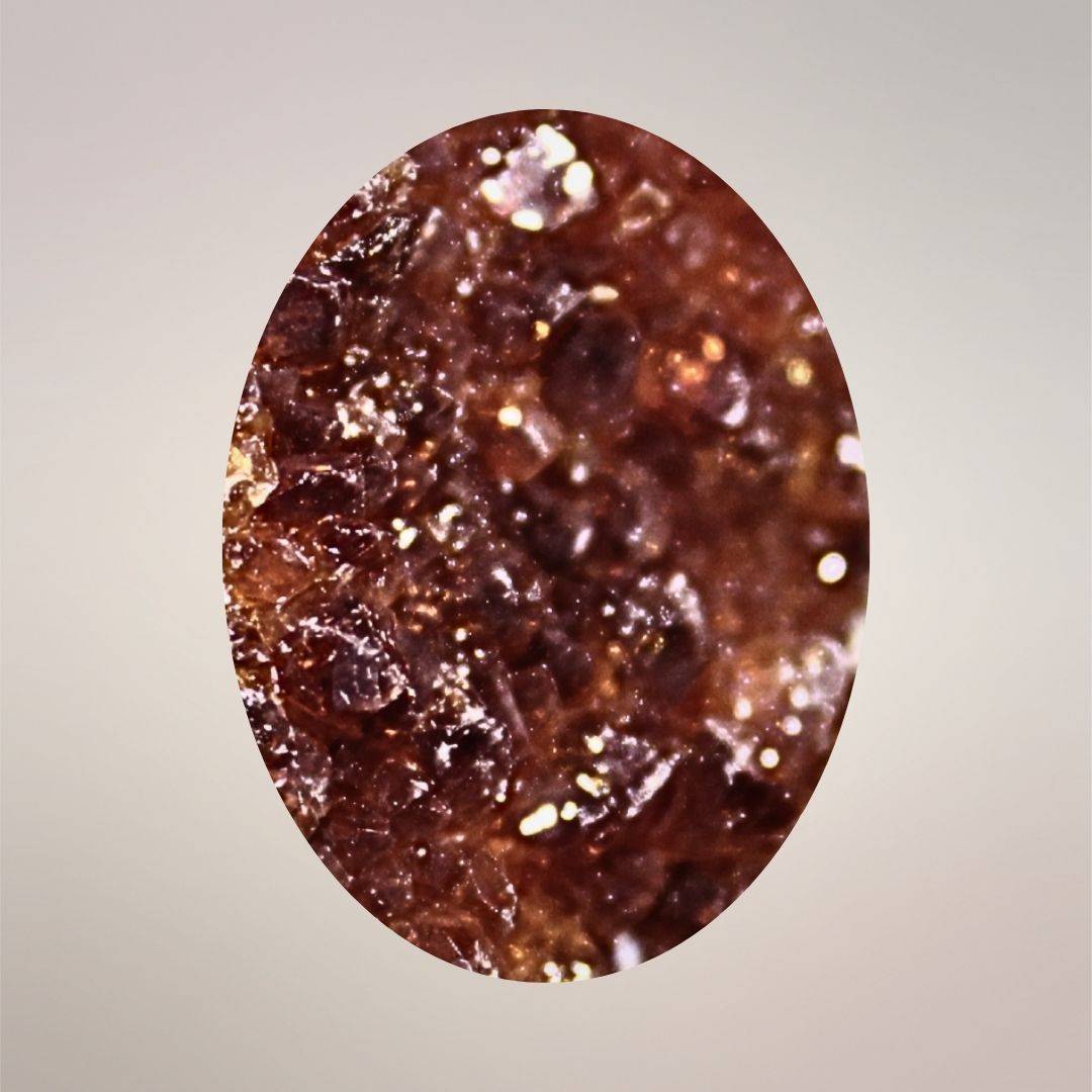 Macro view of smoky citrine cluster pendant with deep golden-brown quartz terminations and natural sparkle