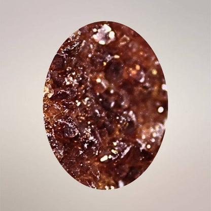 Macro view of smoky citrine cluster pendant with deep golden-brown quartz terminations and natural sparkle