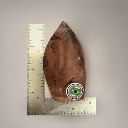Brazilian Smoky Quartz Flame beside an inch ruler, showing its approximately 3.25-inch height and 2-inch width.