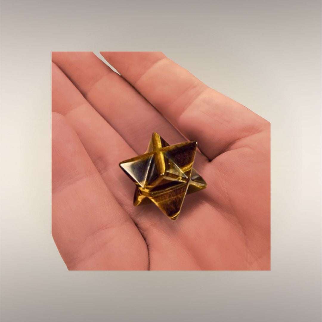 Tigers Eye Merkaba stone held in hand for meditation or energy work