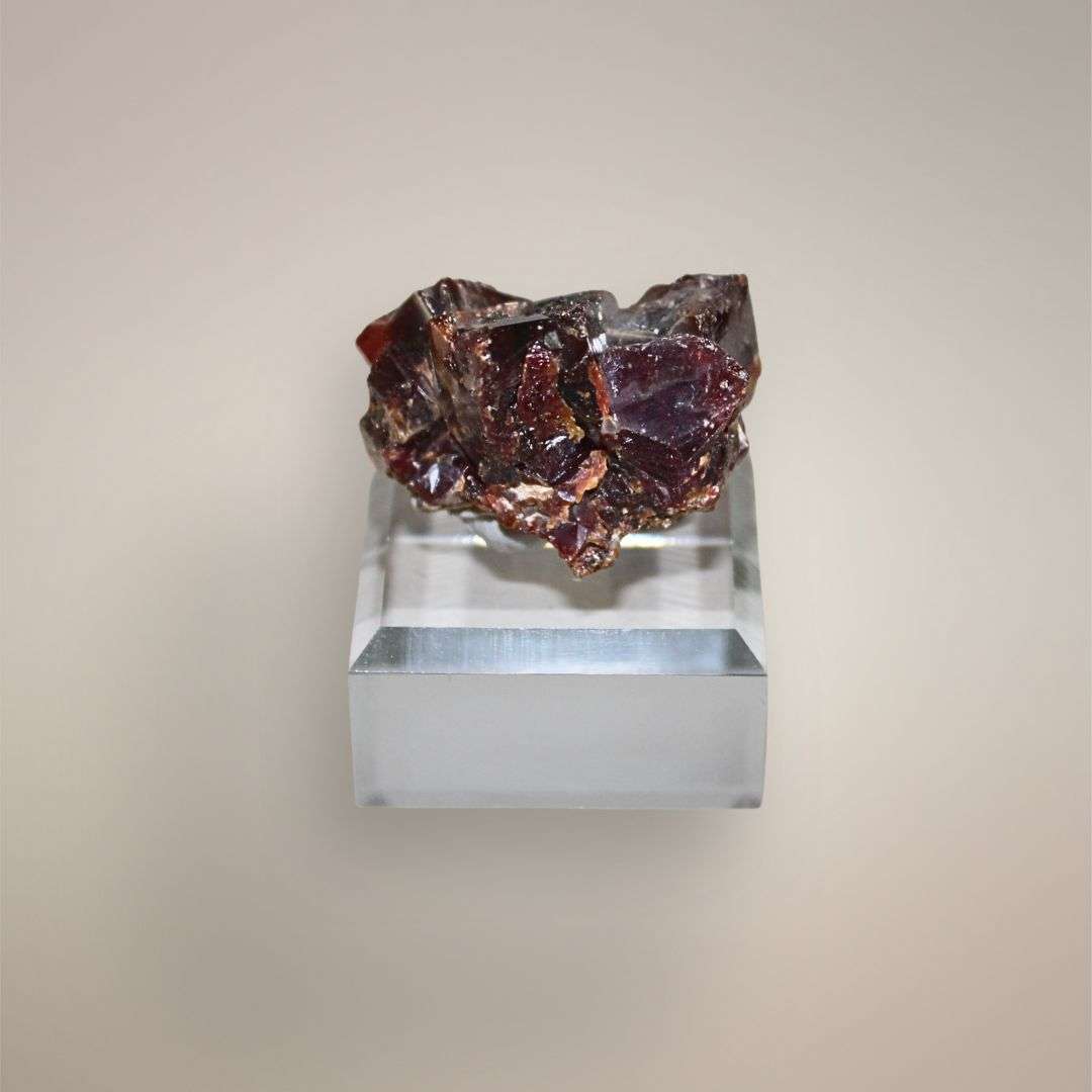 Reverse view of Moroccan Vanadinite cluster showing deep red-brown intergrown crystal faces
