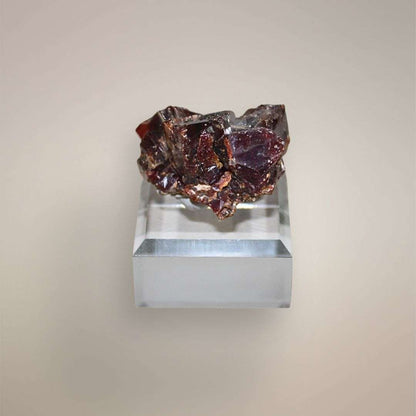 Reverse view of Moroccan Vanadinite cluster showing deep red-brown intergrown crystal faces
