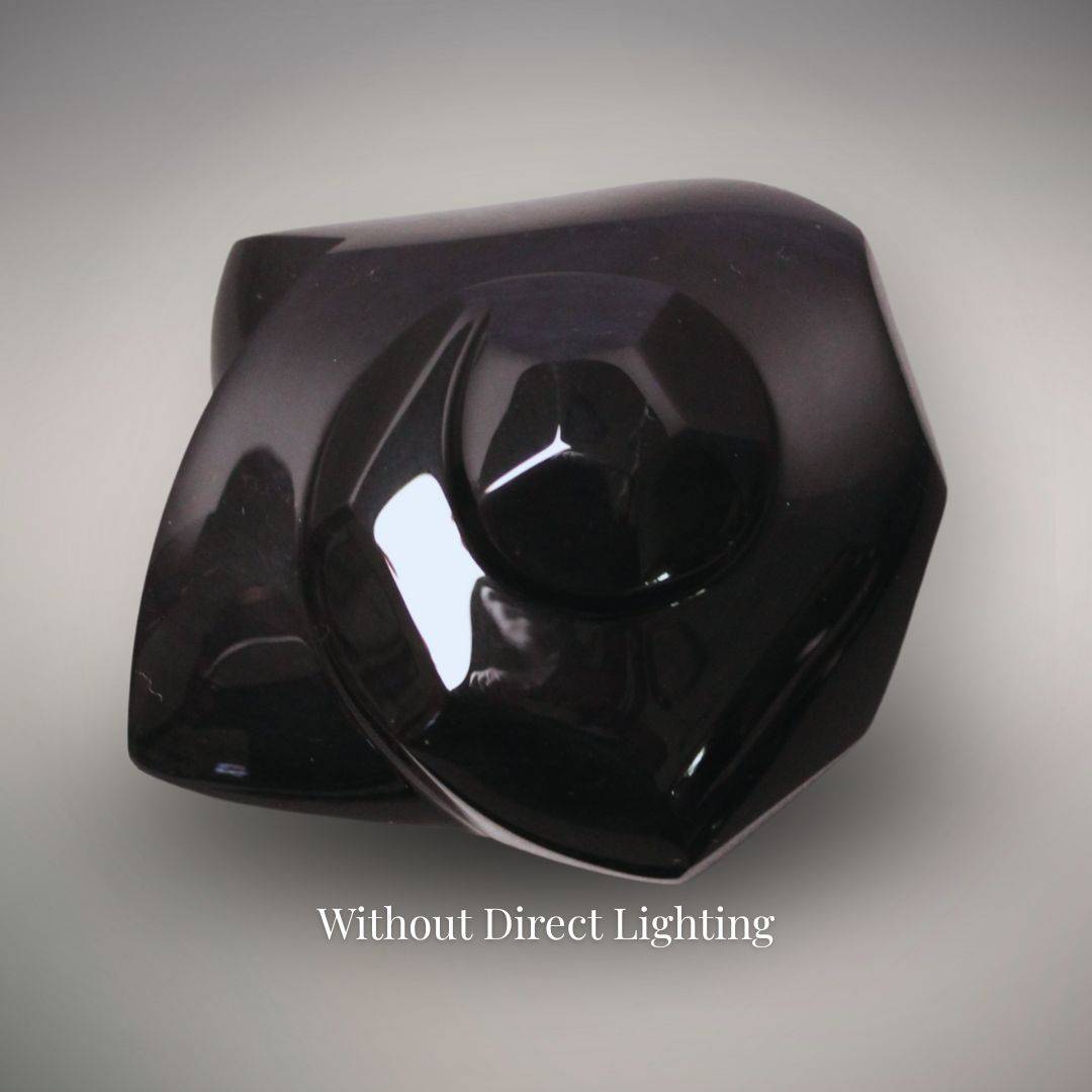 Velvet Rainbow Obsidian freeform from Mexico without direct lighting, showing a glossy near-black surface with subtle purple coloration.
