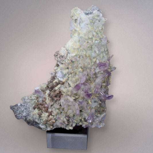 Front view of Mexico Veracruz Amethyst cluster with lavender-purple prismatic crystals, three scepter formations, pale matrix, and brown lepidocrocite-bearing areas.
