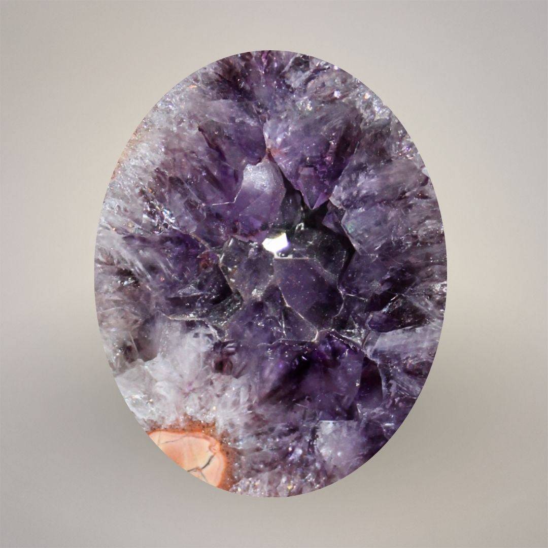 Close view of deep purple amethyst crystal center inside Waldhambach agate specimen from Germany.
