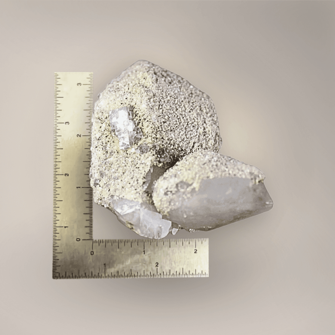 Quartz with scheelite and fluorite specimen beside ruler showing approximately 3.5-inch overall size.