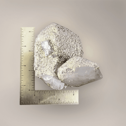 Quartz with scheelite and fluorite specimen beside ruler showing approximately 3.5-inch overall size.